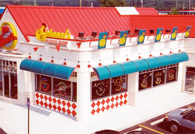 Blue awning installed on retro-looking restaurant exterior