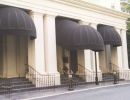 dome awnings outside of white building
