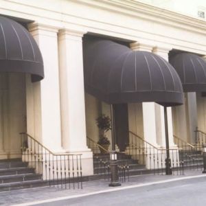 dome awnings outside of white building